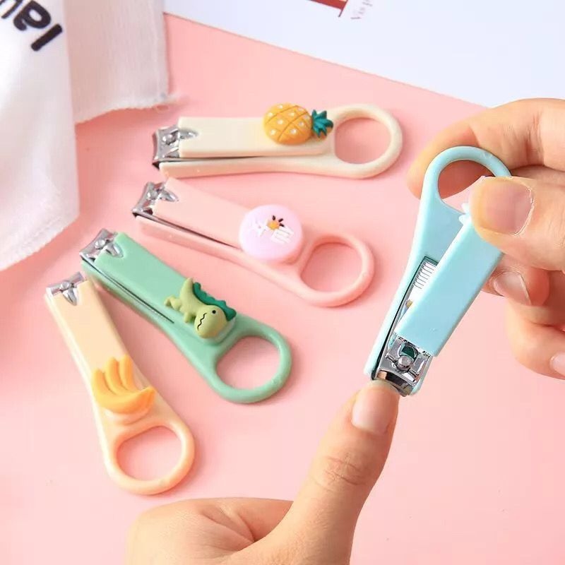 Compact size HERCULES BEAR baby nail clippers shown in parent’s hand for newborn nail care